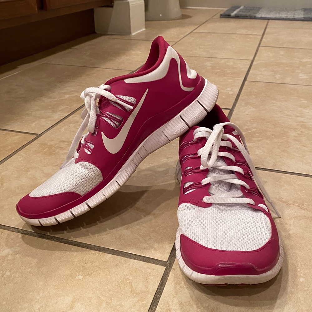 Women’s pink and white Nike Free Run